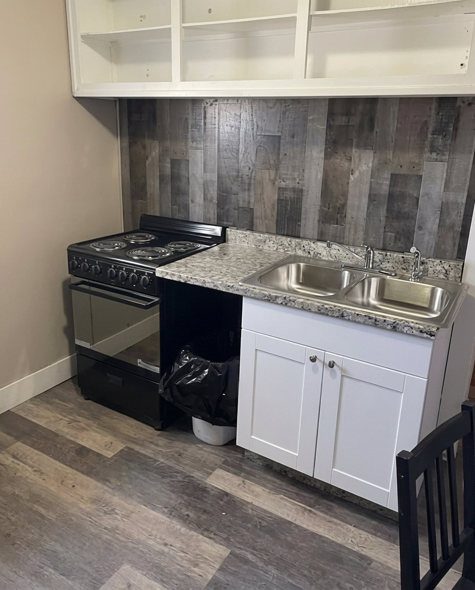 Kitchenette with full-size stove and double sink
